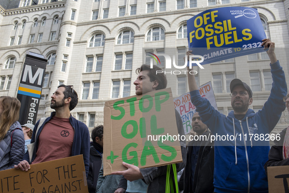 Environmental activists rally to demand climate action before US President-elect Donald Trump takes office in Washington, DC, on November 17...