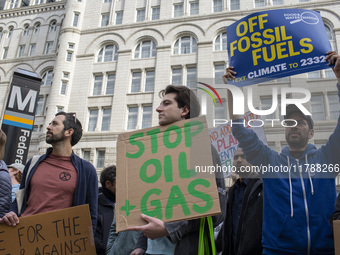 Environmental activists rally to demand climate action before US President-elect Donald Trump takes office in Washington, DC, on November 17...