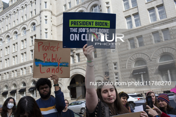 Environmental activists rally to demand climate action before US President-elect Donald Trump takes office in Washington, DC, on November 17...