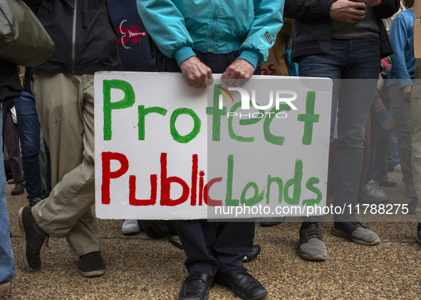 Environmental activists rally to demand climate action before US President-elect Donald Trump takes office in Washington, DC, on November 17...