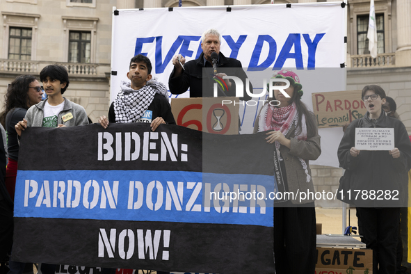 Environmental activists demonstrate outside the Federal Triangle Metro Station in Washington DC, USA, on November 17, 2024. The rally demand...