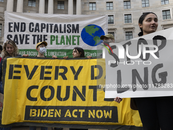 Environmental activists demonstrate outside the Federal Triangle Metro Station in Washington DC, USA, on November 17, 2024. The rally demand...