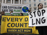 Environmental activists demonstrate outside the Federal Triangle Metro Station in Washington DC, USA, on November 17, 2024. The rally demand...