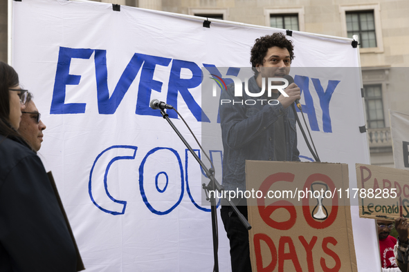 A climate protester gives a speech while environmental activists demonstrate outside the Federal Triangle Metro Station in Washington DC, US...