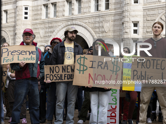 Environmental activists demonstrate outside the Federal Triangle Metro Station in Washington DC, USA, on November 17, 2024. The rally demand...