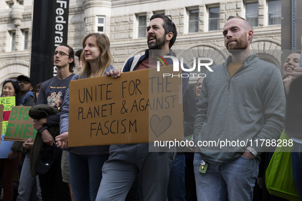 Environmental activists demonstrate outside the Federal Triangle Metro Station in Washington DC, USA, on November 17, 2024. The rally demand...