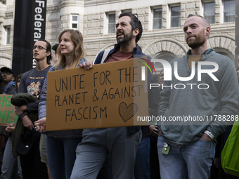 Environmental activists demonstrate outside the Federal Triangle Metro Station in Washington DC, USA, on November 17, 2024. The rally demand...