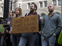 Environmental activists demonstrate outside the Federal Triangle Metro Station in Washington DC, USA, on November 17, 2024. The rally demand...