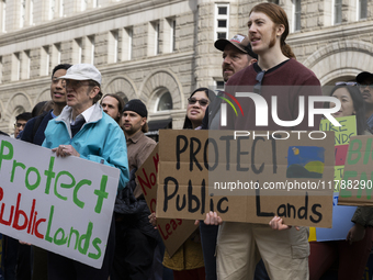 Environmental activists demonstrate outside the Federal Triangle Metro Station in Washington DC, USA, on November 17, 2024. The rally demand...