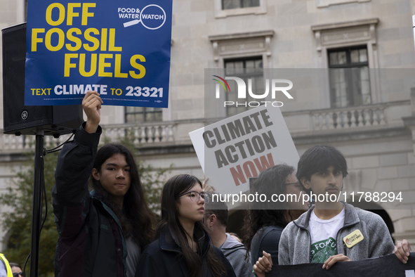 Environmental activists demonstrate outside the Federal Triangle Metro Station in Washington DC, USA, on November 17, 2024. The rally demand...