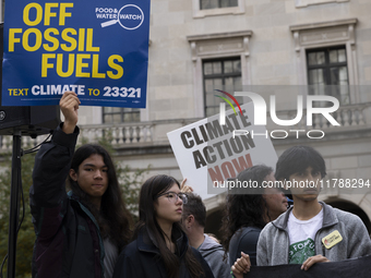 Environmental activists demonstrate outside the Federal Triangle Metro Station in Washington DC, USA, on November 17, 2024. The rally demand...