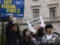 Environmental activists demonstrate outside the Federal Triangle Metro Station in Washington DC, USA, on November 17, 2024. The rally demand...