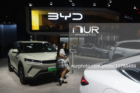 Visitors visit BYD's stand at the Guangzhou Auto Show 2024 in Guangzhou, Guangdong, China, on November 15, 2024. China's new energy vehicle...