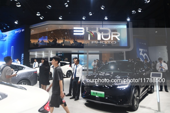 Visitors visit BYD's stand at the Guangzhou Auto Show 2024 in Guangzhou, Guangdong, China, on November 15, 2024. China's new energy vehicle...