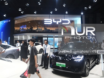 Visitors visit BYD's stand at the Guangzhou Auto Show 2024 in Guangzhou, Guangdong, China, on November 15, 2024. China's new energy vehicle...