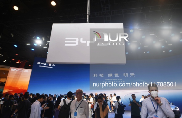 Visitors visit BYD's stand at the Guangzhou Auto Show 2024 in Guangzhou, Guangdong, China, on November 15, 2024. China's new energy vehicle...