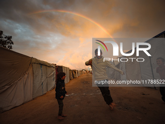 Palestinian children play among the tents of internally displaced persons who flee the Israeli military bombing and incursion in the norther...