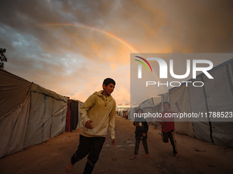 Palestinian children play among the tents of internally displaced persons who flee the Israeli military bombing and incursion in the norther...