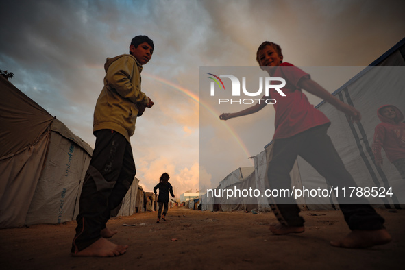 Palestinian children play among the tents of internally displaced persons who flee the Israeli military bombing and incursion in the norther...