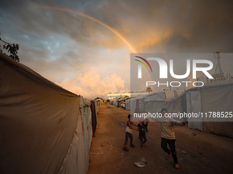 Palestinian children play among the tents of internally displaced persons who flee the Israeli military bombing and incursion in the norther...