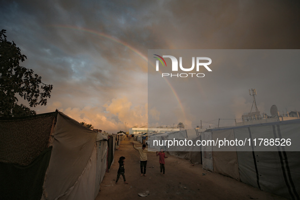 Palestinian children play among the tents of internally displaced persons who flee the Israeli military bombing and incursion in the norther...