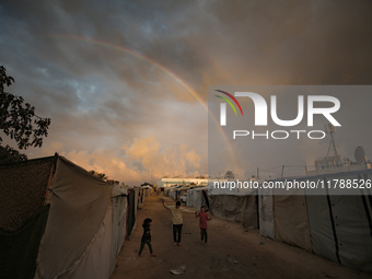 Palestinian children play among the tents of internally displaced persons who flee the Israeli military bombing and incursion in the norther...