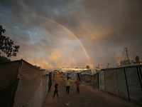 Palestinian children play among the tents of internally displaced persons who flee the Israeli military bombing and incursion in the norther...