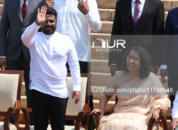 Sri Lankan president Anura Kumara Dissanayake acknowledges the supporters as Prime Minister Harini Amarasuriya looks on with newly appointed...