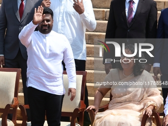 Sri Lankan president Anura Kumara Dissanayake acknowledges the supporters as Prime Minister Harini Amarasuriya looks on with newly appointed...