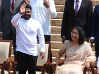 Sri Lankan president Anura Kumara Dissanayake acknowledges the supporters as Prime Minister Harini Amarasuriya looks on with newly appointed...