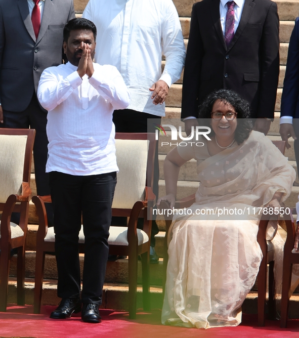 Sri Lankan president Anura Kumara Dissanayake acknowledges the supporters as Prime Minister Harini Amarasuriya looks on with newly appointed...