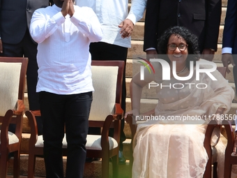 Sri Lankan president Anura Kumara Dissanayake acknowledges the supporters as Prime Minister Harini Amarasuriya looks on with newly appointed...