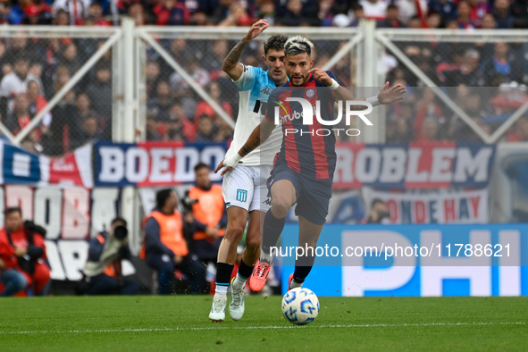 Ivan Leguizamon of San Lorenzo competes for the ball against Gaston Martirena of Racing Club during a Liga Profesional 2024 match between Sa...