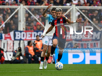 Ivan Leguizamon of San Lorenzo competes for the ball against Gaston Martirena of Racing Club during a Liga Profesional 2024 match between Sa...