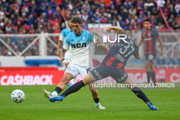 Elias Baez of San Lorenzo competes for the ball against Gaston Martirena of Racing Club during a Liga Profesional 2024 match between San Lor...