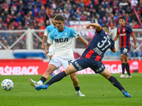 Elias Baez of San Lorenzo competes for the ball against Gaston Martirena of Racing Club during a Liga Profesional 2024 match between San Lor...