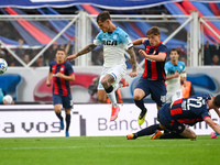 Gaston Campi of San Lorenzo competes for the ball against Bruno Zuculini of Racing Club during a Liga Profesional 2024 match between San Lor...