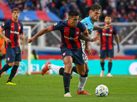 Alexis Cuello of San Lorenzo competes for the ball against Bruno Zuculini of Racing Club during a Liga Profesional 2024 match between San Lo...