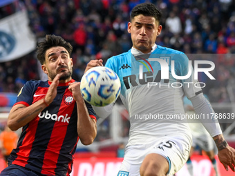 Cerutti of San Lorenzo competes for the ball against Santiago Quiroz of Racing Club during a Liga Profesional 2024 match between San Lorenzo...