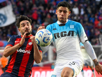 Cerutti of San Lorenzo competes for the ball against Santiago Quiroz of Racing Club during a Liga Profesional 2024 match between San Lorenzo...