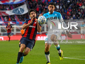 Cerutti of San Lorenzo competes for the ball against Santiago Quiroz of Racing Club during a Liga Profesional 2024 match between San Lorenzo...