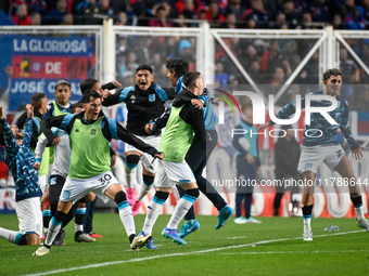 Gustavo Costas, coach of Racing Club, celebrates with his teammates after his team scores a goal during a Liga Profesional 2024 match betwee...