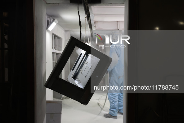 A worker produces intelligent devices in a manufacturing workshop in Binzhou City, Shandong Province, China, on November 18, 2024. 