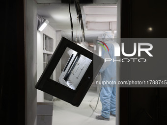 A worker produces intelligent devices in a manufacturing workshop in Binzhou City, Shandong Province, China, on November 18, 2024. (