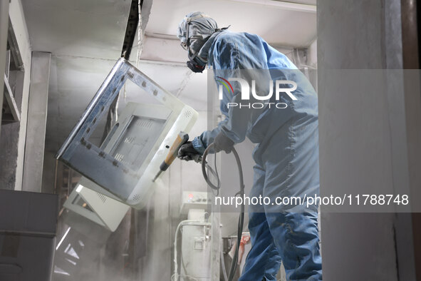 A worker produces intelligent devices in a manufacturing workshop in Binzhou City, Shandong Province, China, on November 18, 2024. 