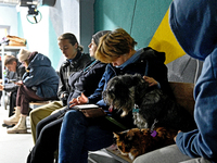 In Kyiv, Ukraine, on November 17, 2024, people with pets stay in a bomb shelter during an air alert caused by a large-scale Russian missile...