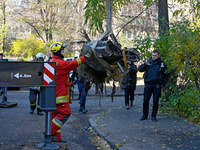 Workers of the State Emergency Service remove part of a Russian missile that hits a five-storey apartment building in the Pecherskyi distric...