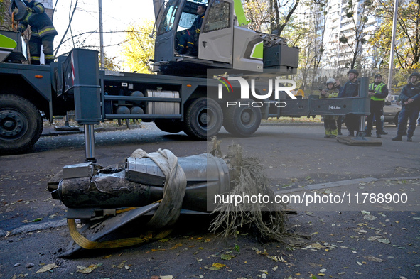 A fragment of a Russian missile is on the ground after being removed by State Emergency Service workers from a five-storey apartment buildin...