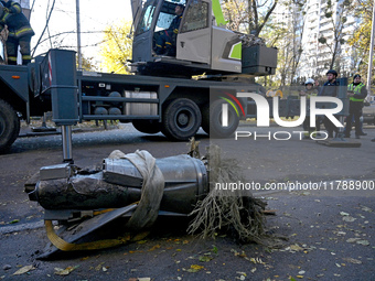 A fragment of a Russian missile is on the ground after being removed by State Emergency Service workers from a five-storey apartment buildin...