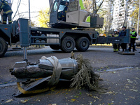 A fragment of a Russian missile is on the ground after being removed by State Emergency Service workers from a five-storey apartment buildin...